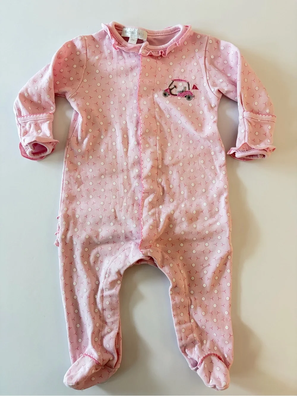 Magnolia baby pink footie with golf cart and golf ball print 3Mo